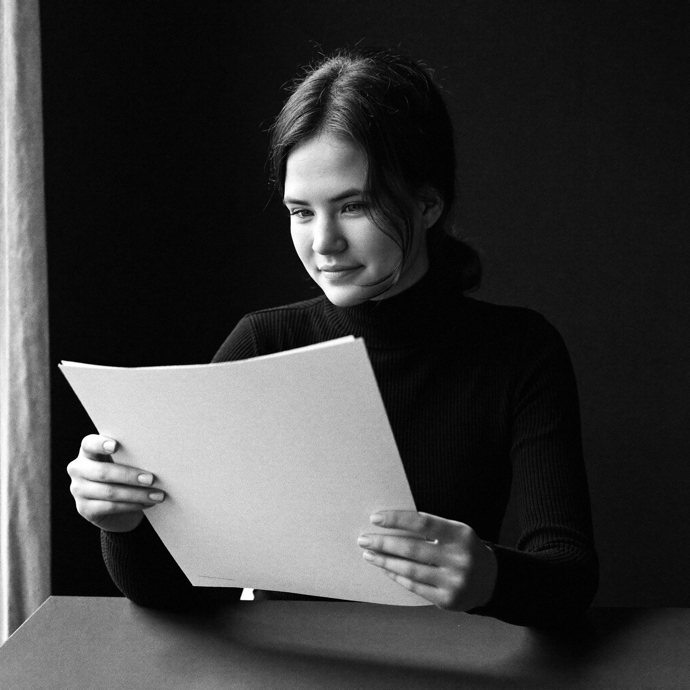 Naomi reviewing an estate file at her desk